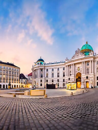 Cityscape image of Vienna, Austria with St. Michael's Square during sunrise.